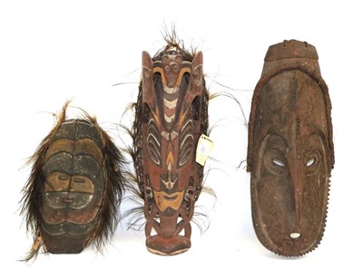 Lot 190 - A Ramu River Flute Mask, New Guinea, of ochre and black painted wood, the small face within...