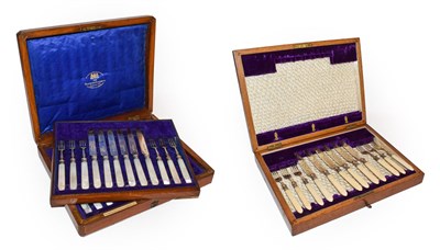 Lot 28 - An Edwardian oak cased set of silver and mother of pearl dessert knives and forks by Goldsmiths...