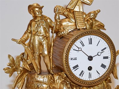 Lot 37 - A 19th century French gilt metal cased timepiece under glass dome 35cm high, including dome