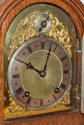 Lot 50 - An oak striking mantel clock, early 20th century, movement backplate stamped W & H Sch, striking on
