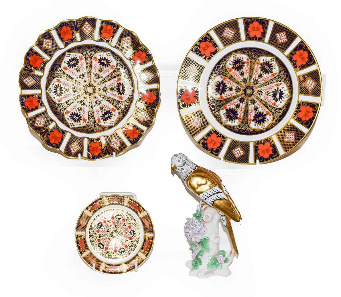Lot 60 - Two royal Crown Derby plates and a pin dish in the Imari pattern 1128, largest 21.5cm diameter (all