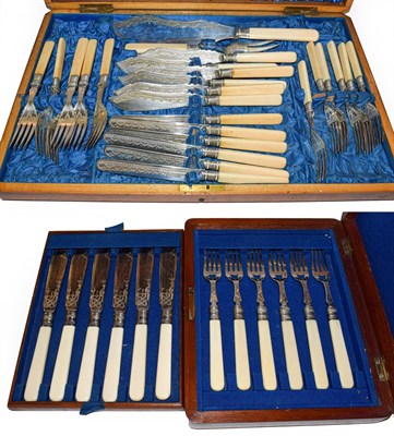 Lot 62 - A Victorian mahogany canteen of ivory handled silver plated cutlery comprising, a pair of fish...