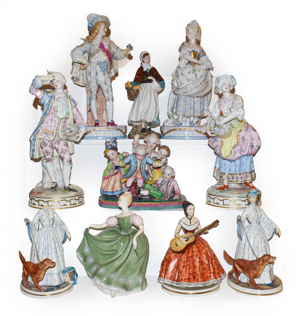 Lot 64 - Two trays of porcelain figures including a German coloured bisque group 'blind mans bluff', two...