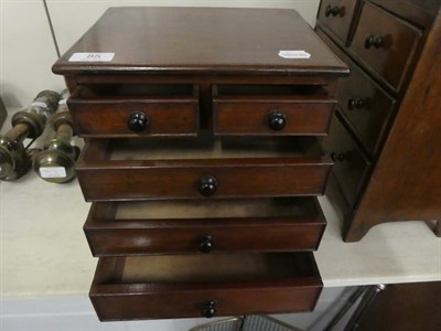 Lot 85 - A 19th century miniature apprentice made mahogany straight fronted chest of drawers, two short over