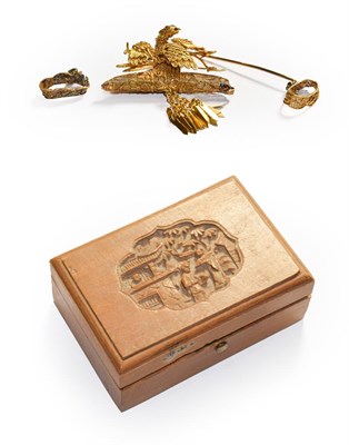 Lot 113 - A brooch depicting a perched bird with a double tassel drop, in a camphor wood box (a.f.)