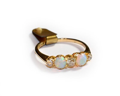 Lot 116 - An opal and diamond five stone ring, three old cut diamonds alternate with two round cabochon opals