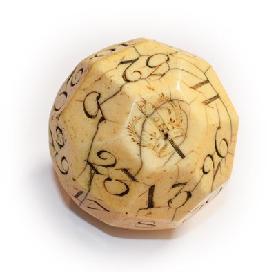 Lot 126 - An early 18th century large ivory teetotum / gambling ball, 32 sides each incised with a...
