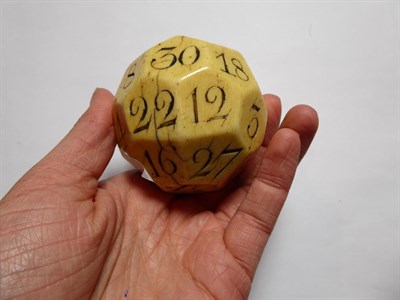 Lot 126 - An early 18th century large ivory teetotum / gambling ball, 32 sides each incised with a...