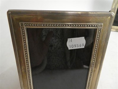 Lot 148 - A sliver photograph frame, Sheffield 2001, 17cm by 22cm together with a pair of matching...