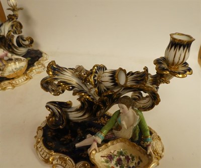Lot 149 - A pair of 19th century English porcelain twin-sconce candle holders modelled with a lady and...