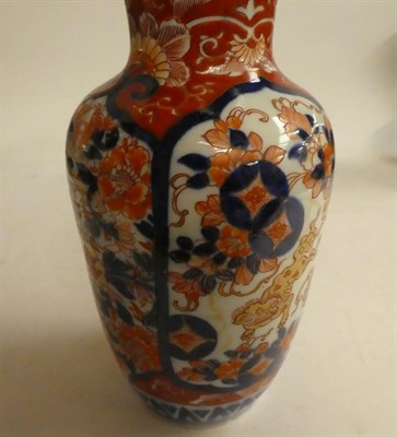 Lot 151 - A Chinese cloisonne twin handled vase on a pale blue ground decorated with lion dogs, seal...