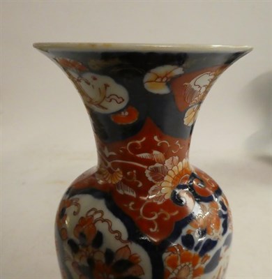 Lot 151 - A Chinese cloisonne twin handled vase on a pale blue ground decorated with lion dogs, seal...