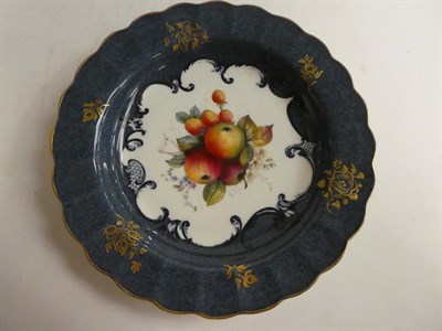 Lot 161 - A pair of Royal Worcester dishes with a crimped edge, blue and gilt decoration with fruit 1925...