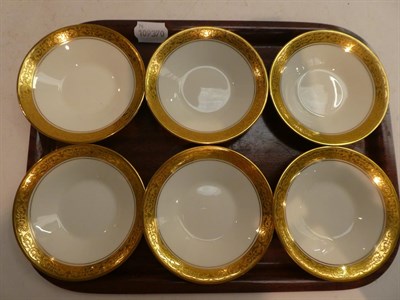Lot 204 - A set of six Royal Worcester coffee cups and saucers in an unusual matte black finish with...