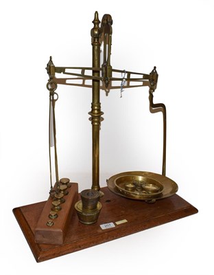 Lot 207 - 19th century pharmacy scales with a quantity of brass weights standing on a mahogany base