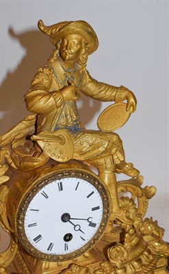 Lot 208 - A 19th century French gilt metal mantle timepiece modelled with a artist and oval portrait and...