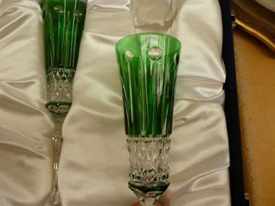Lot 209 - A pair of Faberge champagne flutes in a tinted green glass in presentation case