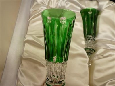 Lot 209 - A pair of Faberge champagne flutes in a tinted green glass in presentation case