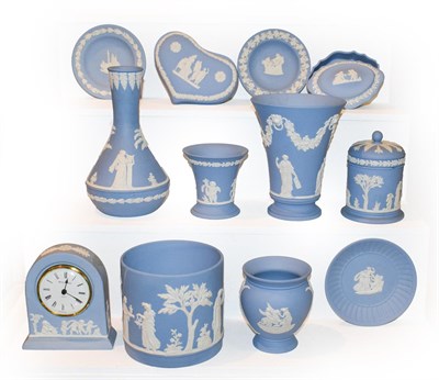 Lot 216 - Wedgwood blue Jasperware comprising five vases, one preserve jar and cover, one mantel clock,...