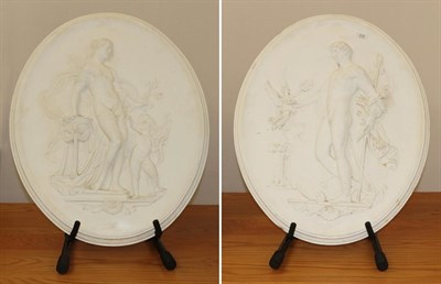 Lot 230 - A pair of 20th century classical oval plaster relieve plaques, one with Venus and Cupid the...