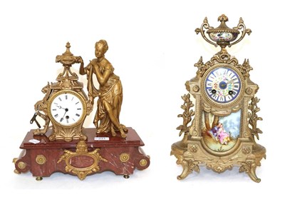 Lot 231 - A French red marble gilt metal figural mantel timepiece and a French gilt metal porcelain...