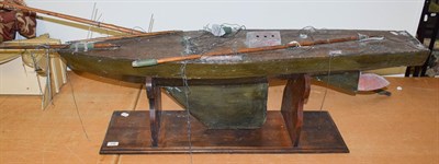 Lot 236 - A large early 20th century painted wooden single masted pond yacht, 150cm long