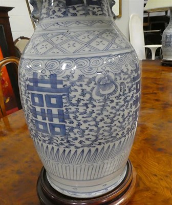 Lot 254 - A pair of Chinese blue and white baluster shaped vases, painted with lotus scrolls and shou...