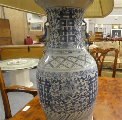 Lot 254 - A pair of Chinese blue and white baluster shaped vases, painted with lotus scrolls and shou...