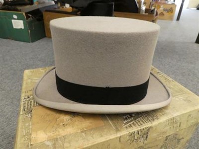 Lot 259 - A Harrods of London grey top hat, 15.5cm by 19.5cm internal measurements, together with a Dunn...