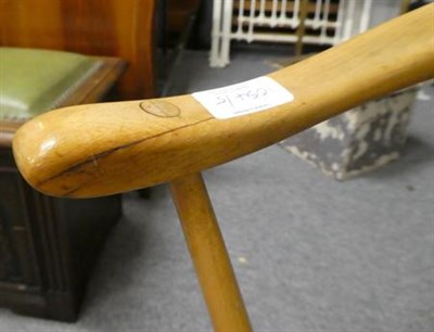Lot 1054 - A light elm Ercol drop leaf table 123cm by 114cm by 72cm together with four matching horseshoe back