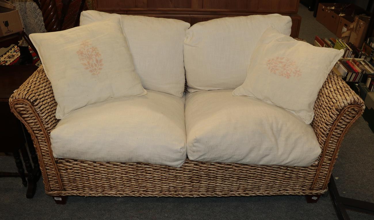 Lot 1057 - A rattan sofa 160cm wide