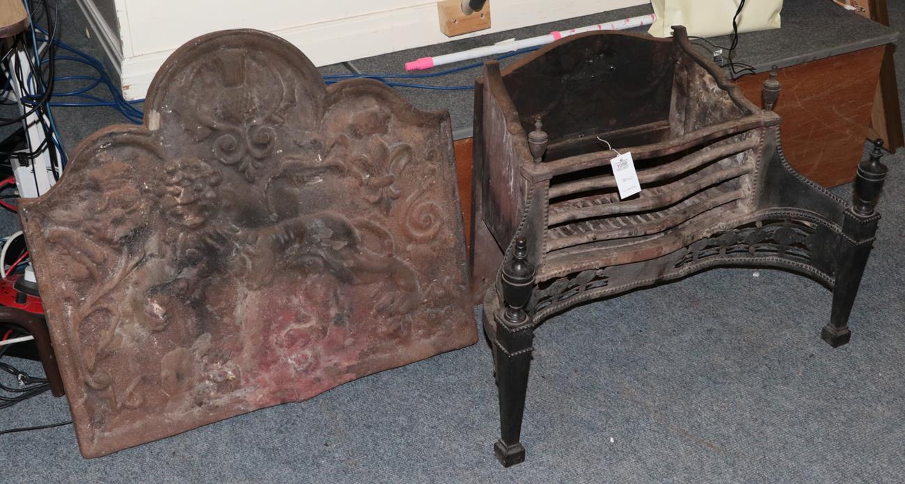 Lot 1058 - A 19th century cast iron fire back decorated in relief with lion passant below a thistle,...