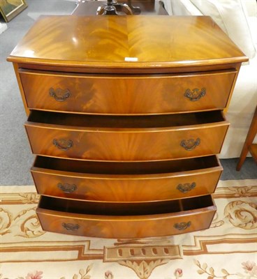 Lot 1065 - A reproduction yew wood bow front four height chest of drawers 77cm by 50cm by 85cm