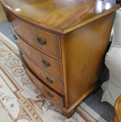 Lot 1065 - A reproduction yew wood bow front four height chest of drawers 77cm by 50cm by 85cm