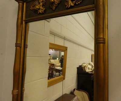Lot 1072 - An oak 1920's desk chair with a swivel action and a gilt wood Regency style wall mirror 49cm by...