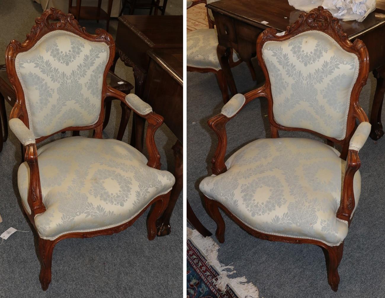 Lot 1080 - A pair of French style gilt carved salon armchairs