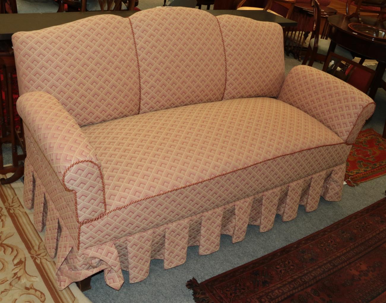 Lot 1093 - An upholstered drop arm sofa, 175cm, together with a button back low chair in matching fabric (2)
