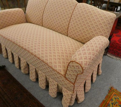 Lot 1093 - An upholstered drop arm sofa, 175cm, together with a button back low chair in matching fabric (2)