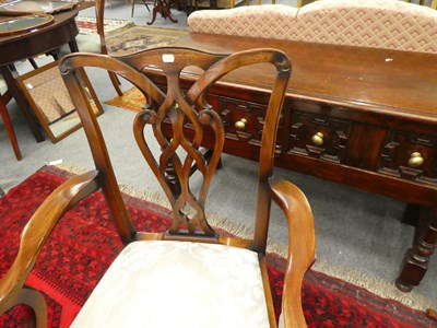 Lot 1094 - A reproduction twin pillar mahogany dining table 245cm by 104cm by 77cm together with a...