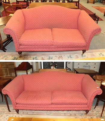 Lot 1102 - A Laura Ashley three seater hump back sofa in upholstered in red, thistle decorated fabric...