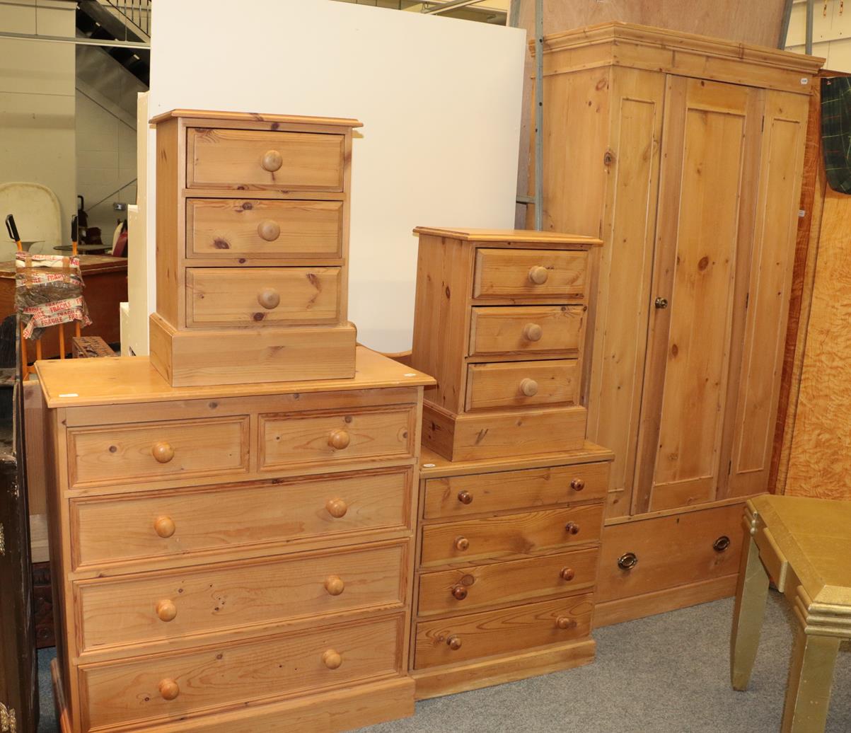 Lot 1111 - Modern pine bedroom furniture comprising a pair of bedside chest of drawers, a four height chest of