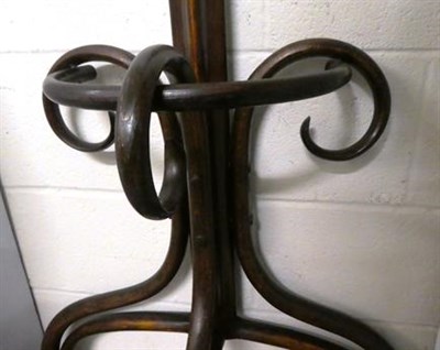 Lot 1119 - An unusual stained bentwood flat-back hatstand, 197cm