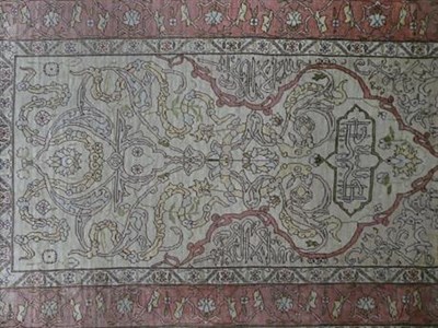 Lot 1123 - Hereke silk Prayer Rug, the field with inscription beneath the Mihrab enclosed by angular vine...