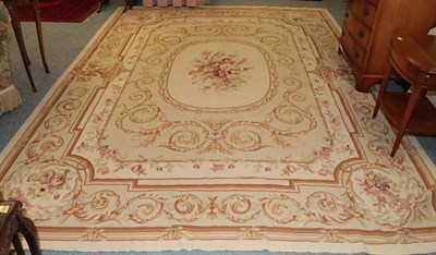 Lot 1126 - A modern needlepoint carpet of Aubusson design, the field of scrolling acanthus vines with oval...