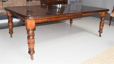 Lot 1132 - A Victorian mahogany wind out dining table with two additional leaves 215cm by 135cm by 74cm