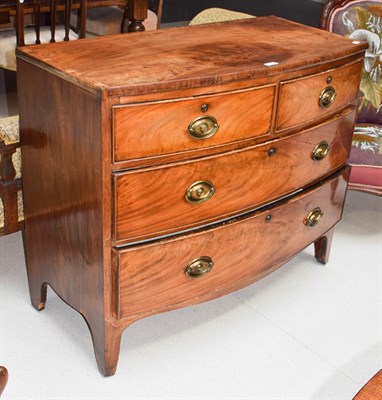Lot 1135 - A George III mahogany bow front three height chest of drawers (distressed) 105cm by 51cm by 90cm