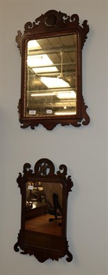 Lot 1145 - Two George III mahogany fret work mirrors, one surmounted by a ho-ho bird the other with a gilt...