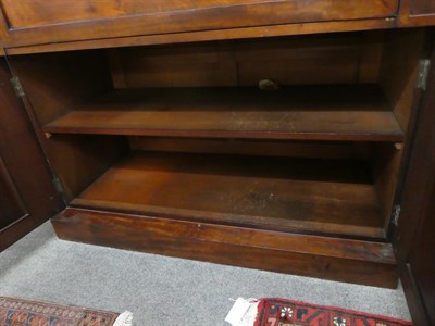 Lot 1148 - Victorian mahogany secretaire bookcase, the fitted interior with birds eye maple drawers and...
