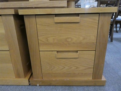 Lot 1152 - A pair of bespoke modern oak bedside two drawer chests 59cm square by 60cm