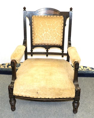 Lot 1163 - An Aesthetic period ebonised open armchair